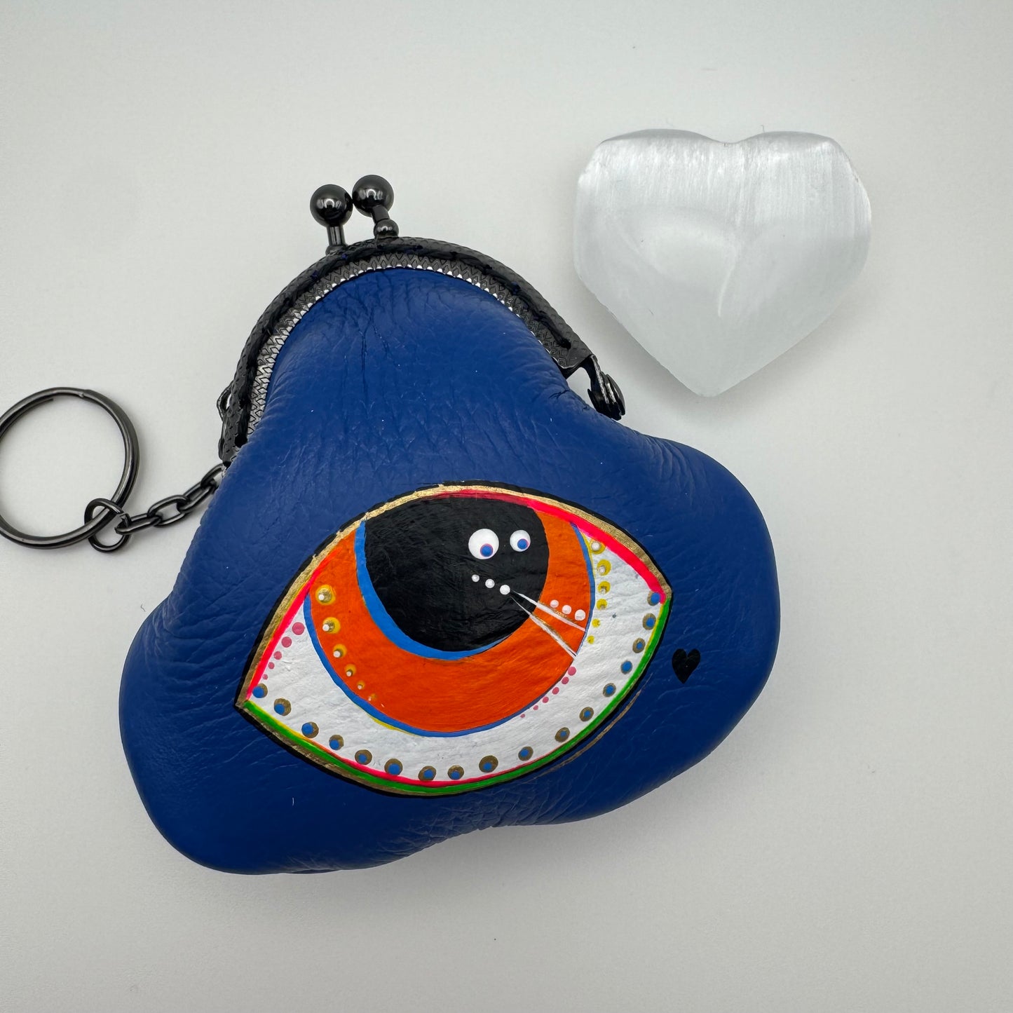 Protective eye leather pouch in Blue with Heart Selenite crystal.