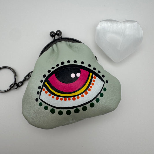 Protective eye leather pouch in Light Green with Heart Selenite crystal.