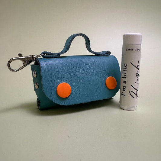 Gloria leather pouch with Honey flavor lip conditioner.
