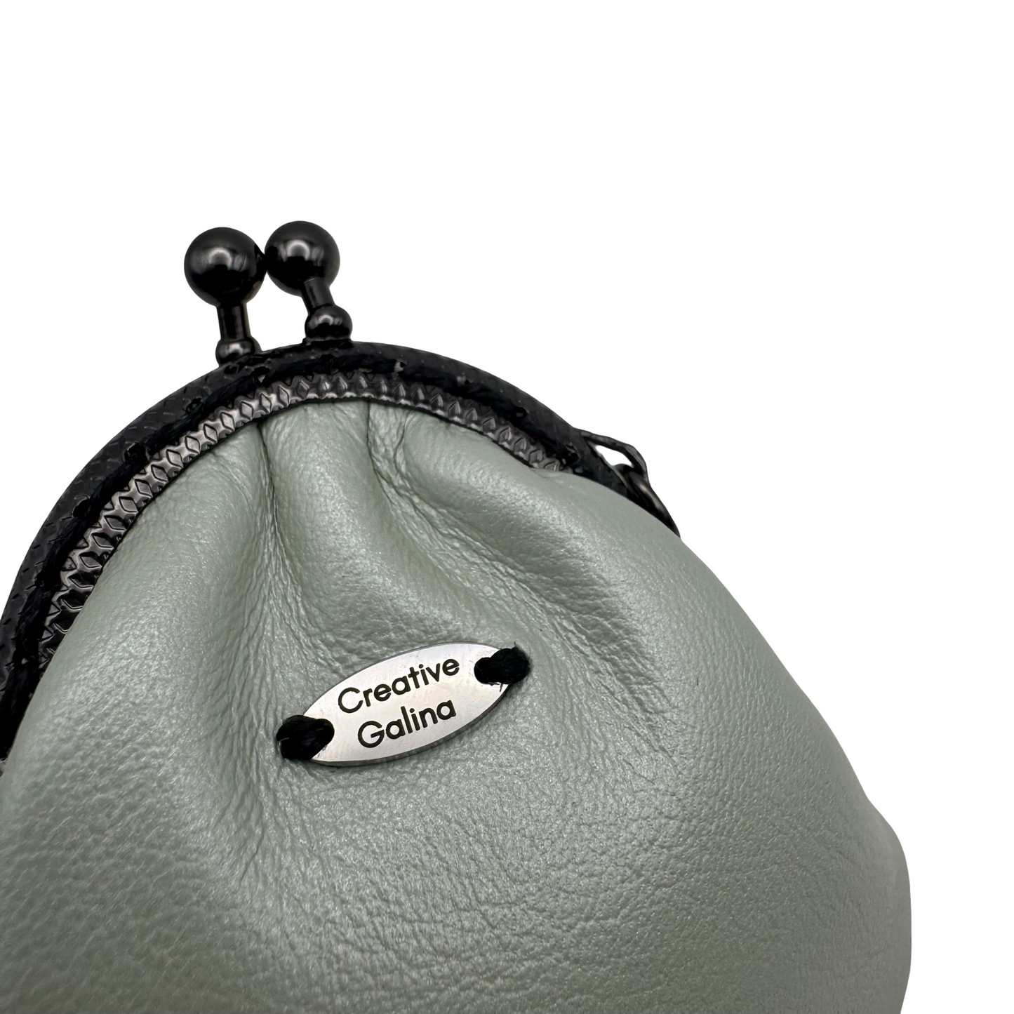 Protective eye leather pouch in Light Green with Heart Selenite crystal.