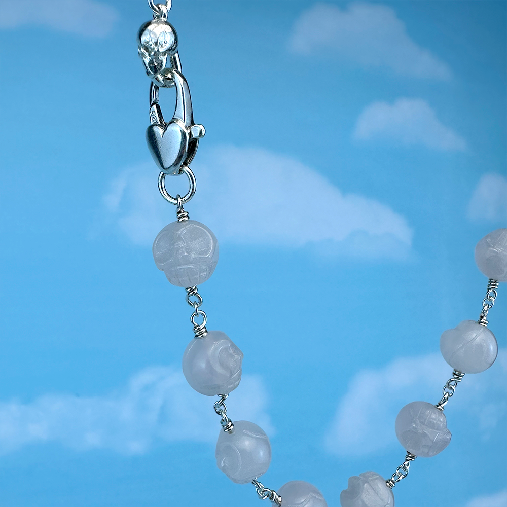 Skull Rose quartz beaded in silver necklace.